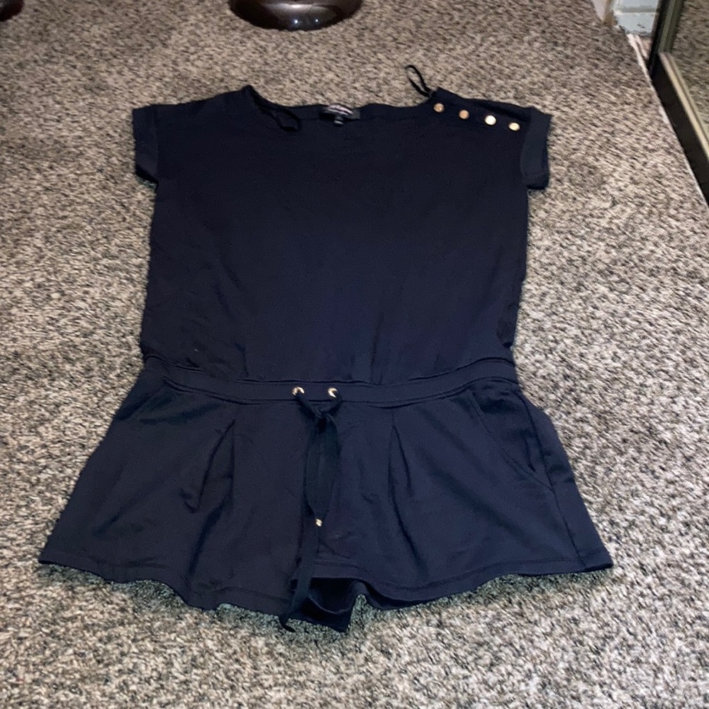 This brand is Juicy Couture. Its like a dark blue, blackish color.
